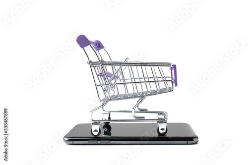 a trolley with copy-space on white background,Shopping online concept © marine0014