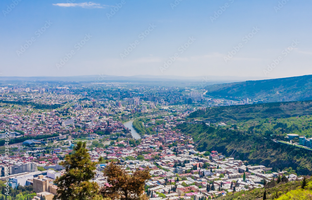 Fototapeta premium Panoramic view of Tbilisi city from Mt Mtatsminda, old town and modern architecture. Georgia