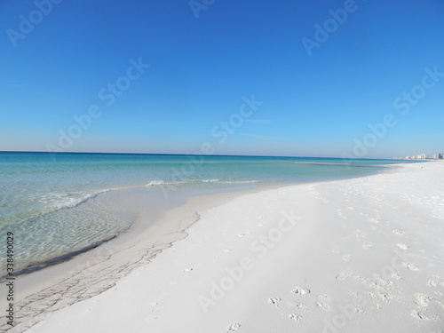 The pristine white sands and distinctively clear water of the Emerald Coast of Florida