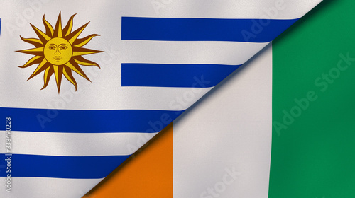 The flags of Uruguay and Ivory Coast. News, reportage, business background. 3d illustration photo