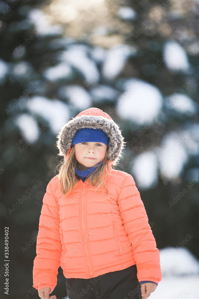 Cute Child Bundled Up In The Winter Snow