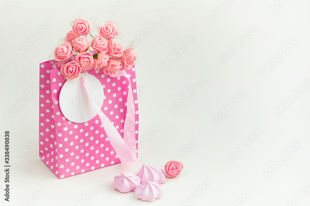 pink paper bag with bouquet of roses, holiday gift card pink paper bag with bouquet of roses, holiday gift card