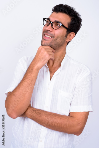 Portrait of happy handsome Turkish man thinking