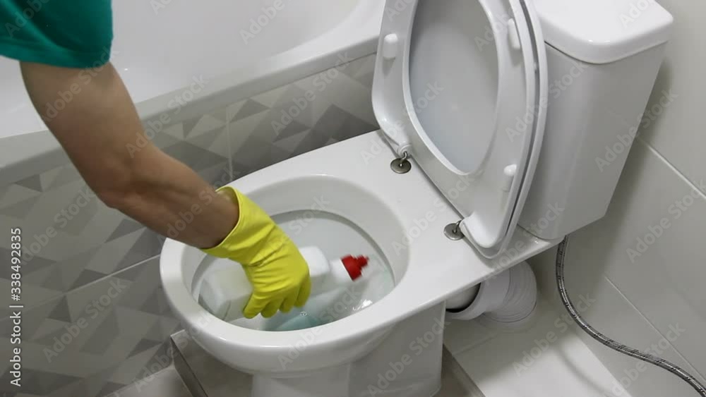 Start Cleaning Toilet with Liquid Detergent Cleaner in yellow gloves. Thumb Down. Start Cleaning Toilet with Liquid Detergent Cleaner in yellow gloves. Thumb Down.