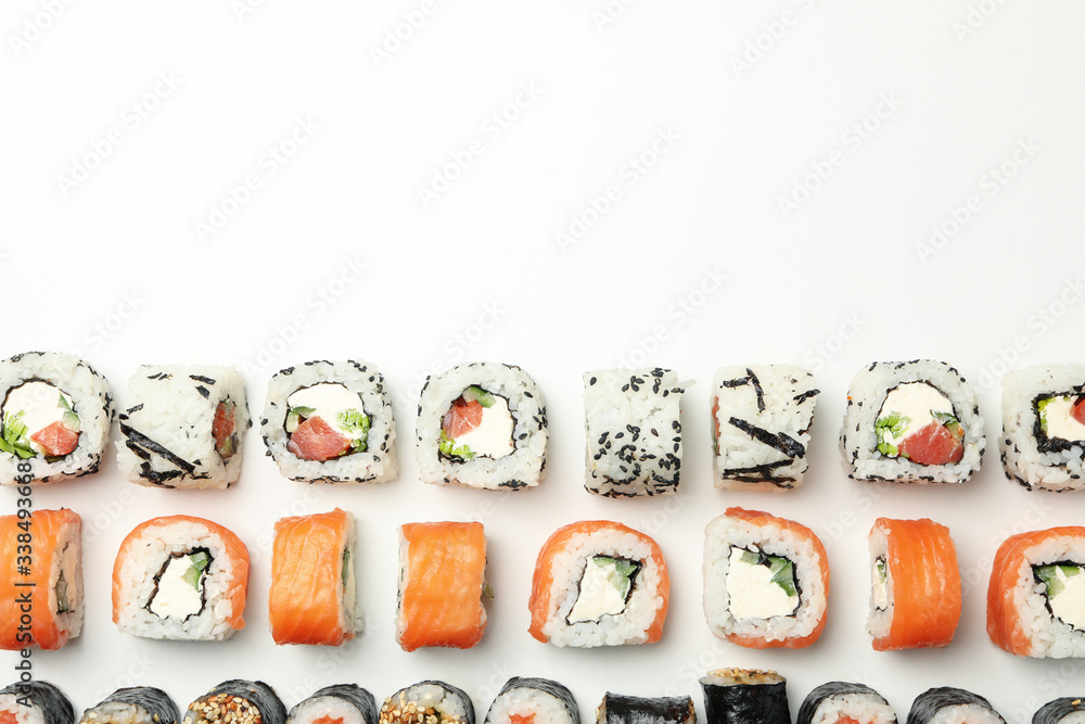 Flat lay with sushi rolls on white background. Japanese food Flat lay with sushi rolls on white background. Japanese food