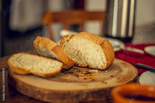 Breakfast table wood with coffee cups and hot bread.