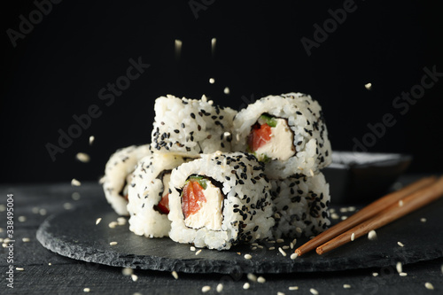 Tray with delicious sushi rolls, close up. Japanese food photo