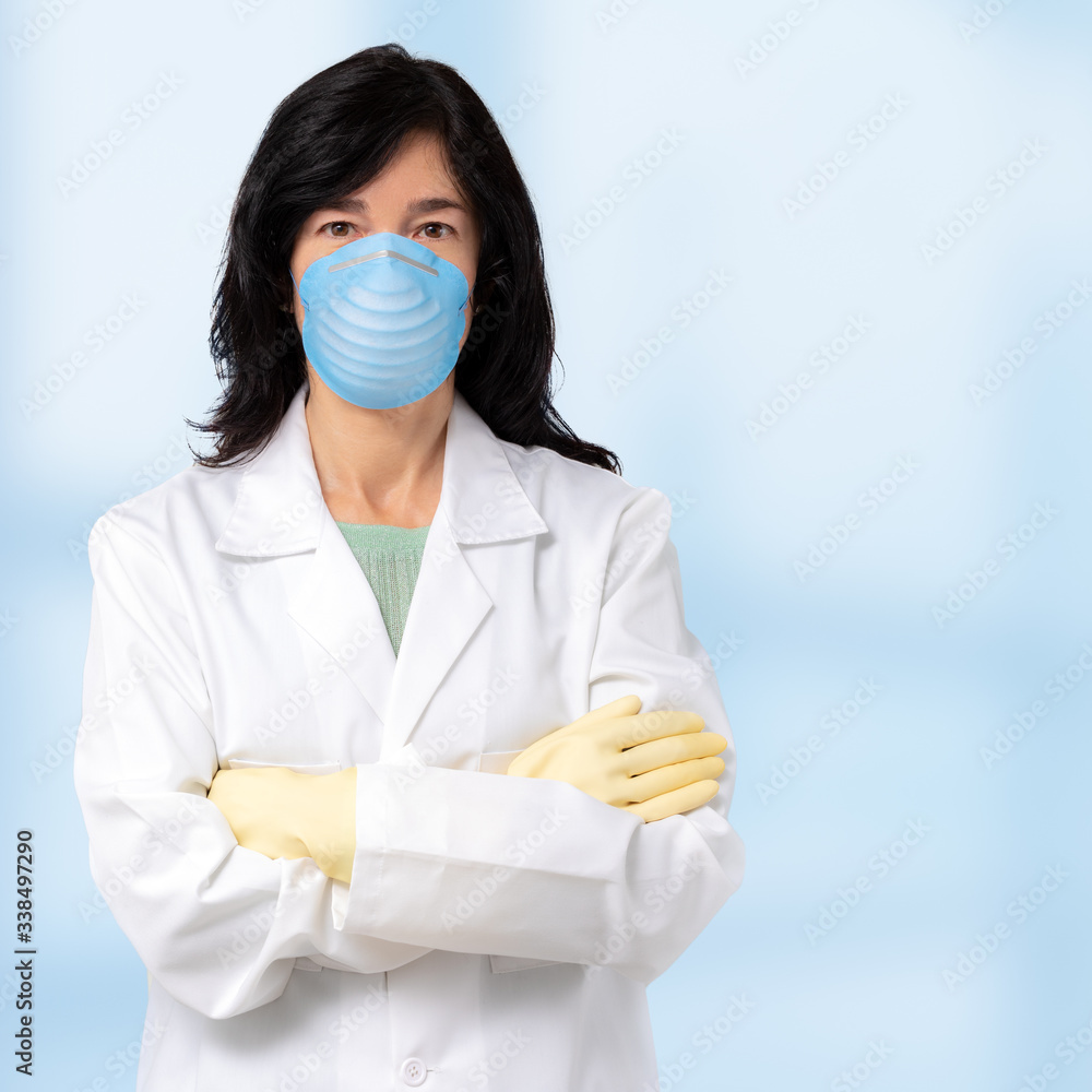 Middle aged doctor wearing surgical mask and gloves. Middle aged doctor wearing surgical mask and gloves.