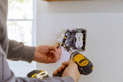 Work on installing electrical outlets. photo