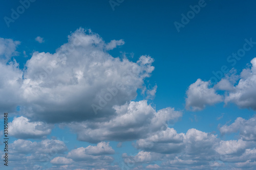 Canvas Print Beautiful cloudy spring sky, snow-white clouds in the blue sky