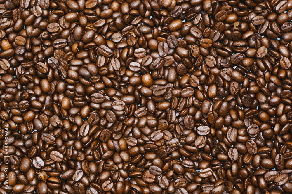 Top view of brown roasted coffee beans, can be use as background, copy space for text. Top view of brown roasted coffee beans, can be use as background, copy space for text.