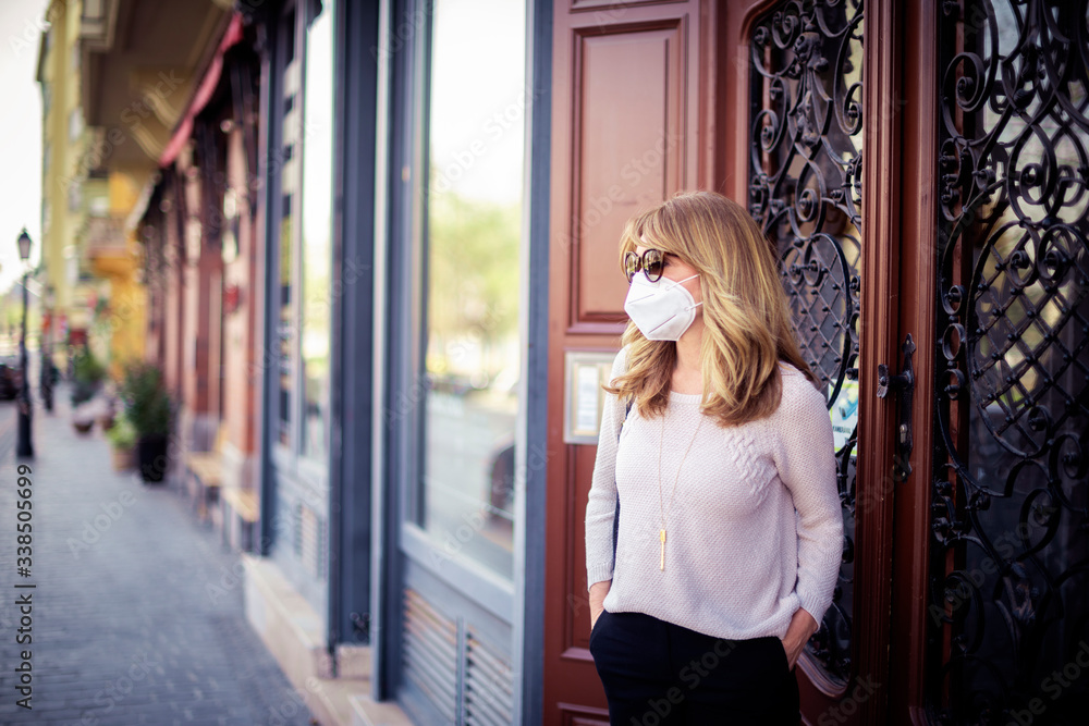 Close-up of mature woman protecting herself with face mask during the coronavirus outbreak Close-up of mature woman protecting herself with face mask during the coronavirus outbreak