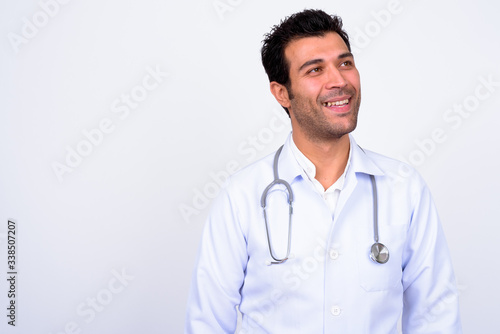 Handsome Turkish man doctor against white background