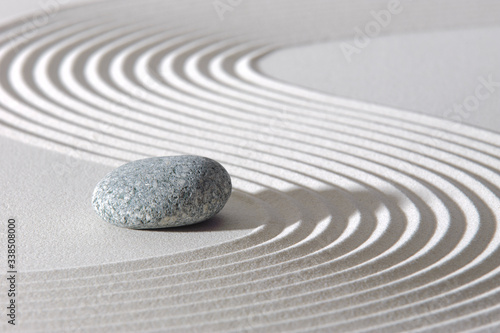 Japanese ZEN garden with stone in textured sand