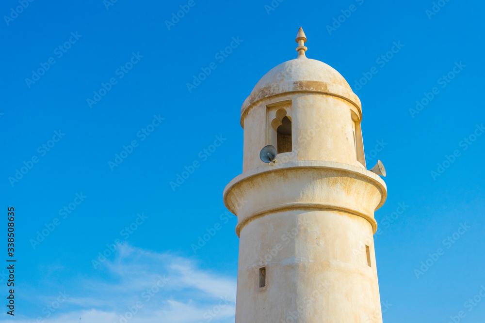 Al Ahmad Mosque, ancient mosque with its minaret in the heart of Souq Waqif, old traditional market in Doha, Qatar 