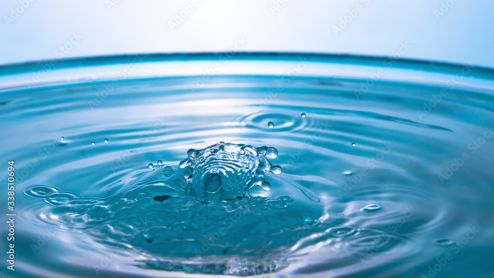 Abstract an outbreak of water. Splash of water close-up. Frozen water drop photographed at high speed.Slow dripping of liquid with air bubbles. Nature backgrounds or Wallpaper.Frozen liquid splashes Abstract an outbreak of water. Splash of water close-up. Frozen water drop photographed at high speed.Slow dripping of liquid with air bubbles. Nature backgrounds or Wallpaper.Frozen liquid splashes