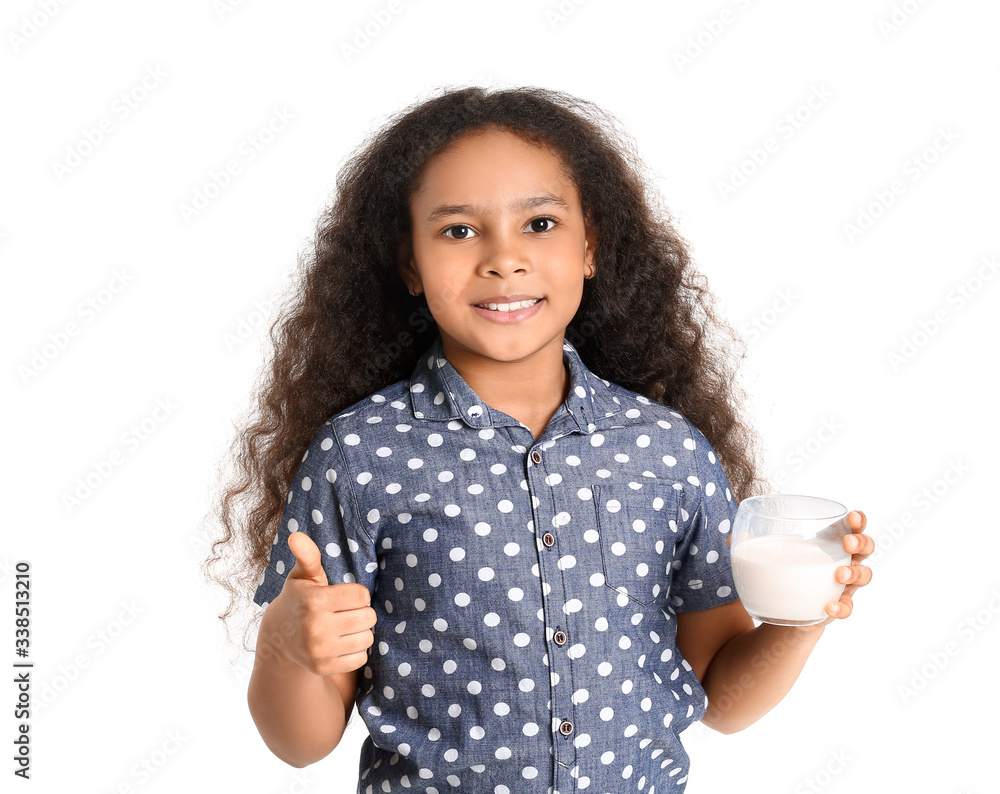 Little African-American girl with milk showing thumb-up on white background Little African-American girl with milk showing thumb-up on white background