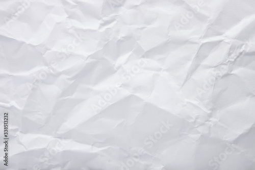 White crumpled paper texture as background. Copy space text