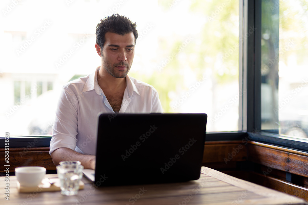 Portrait of handsome Turkish man relaxing at the coffee shop Portrait of handsome Turkish man relaxing at the coffee shop