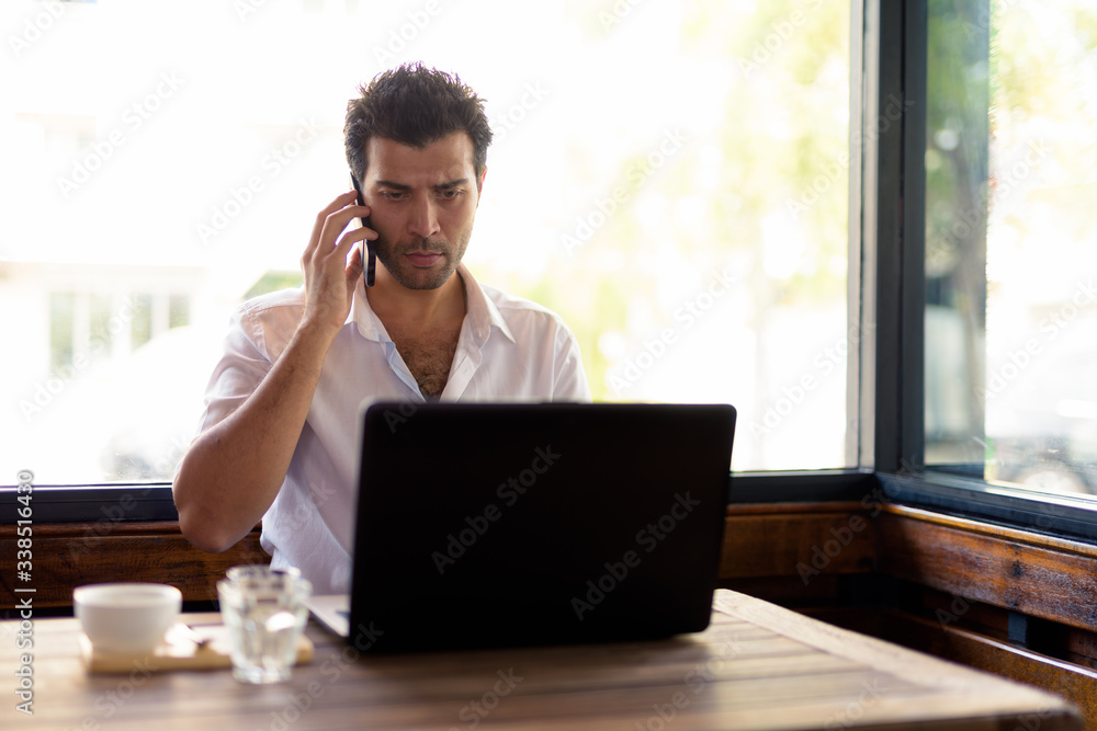 Portrait of handsome Turkish man relaxing at the coffee shop Portrait of handsome Turkish man relaxing at the coffee shop