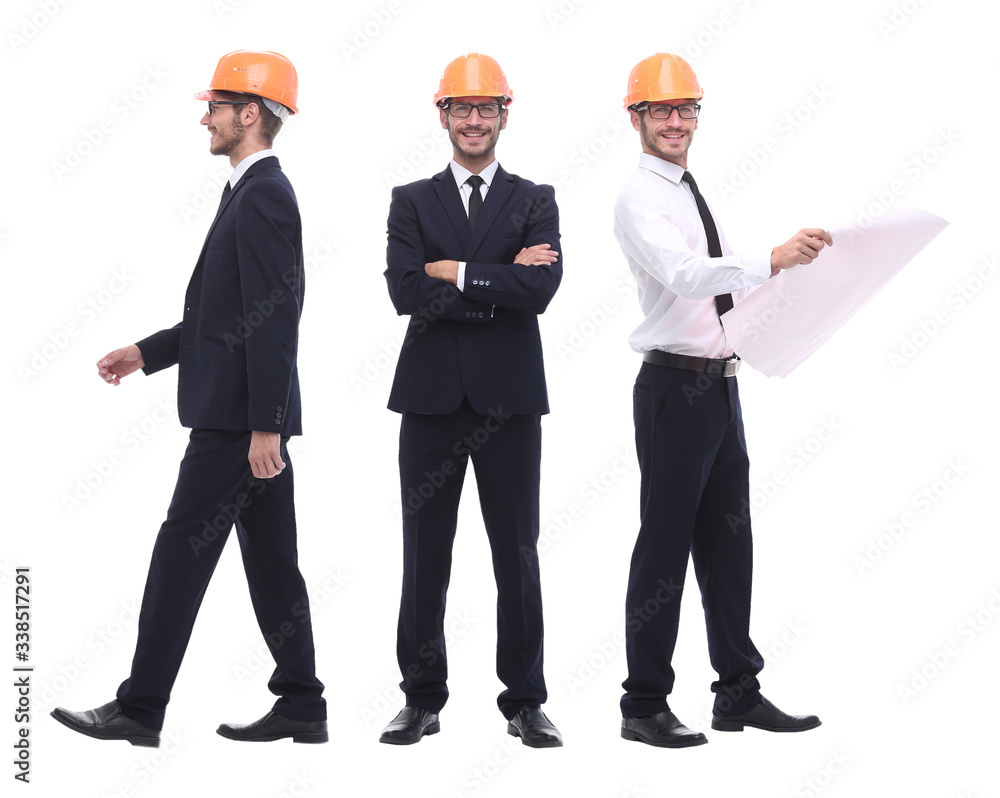 in full growth .a qualified architect in an orange helmet in full growth .a qualified architect in an orange helmet