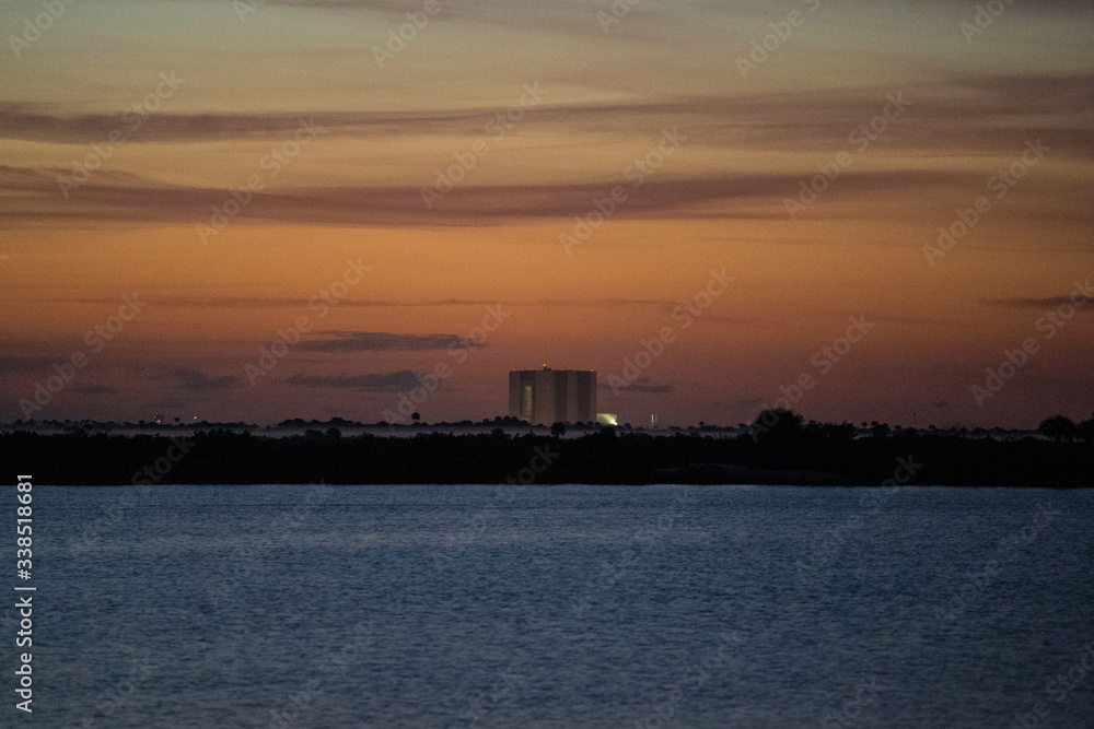 sunrise over lake, launch pad in background, cape canaveral sunrise over lake, launch pad in background, cape canaveral