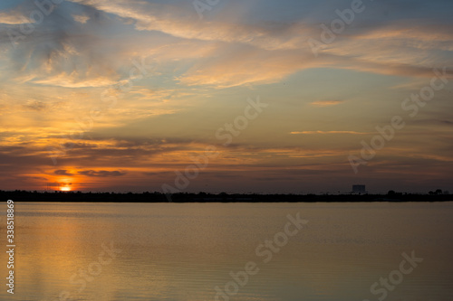 sunrise over lake  launch pad in background  cape canaveral
