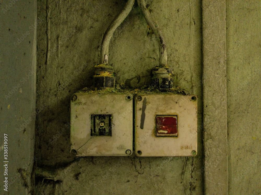 Derelict power switches on the wall in an abandoned building Derelict power switches on the wall in an abandoned building