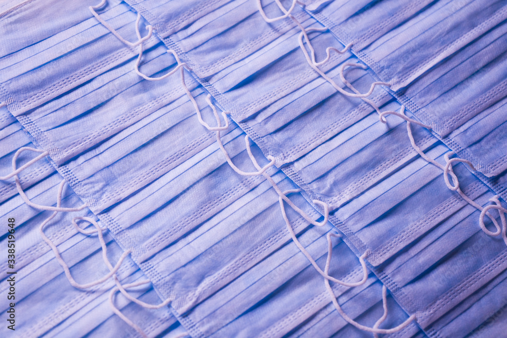 Φωτογραφία a lot of medical face masks for the prevention of coronavirus covid-19 2019-ncov on a white background