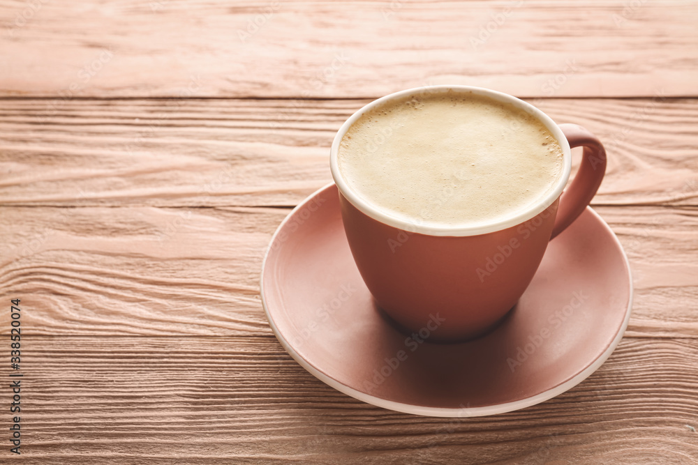 Cup of tasty cappuccino on wooden background Cup of tasty cappuccino on wooden background