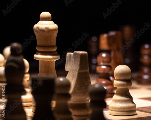 A Macro View of Wood Chess Pieces on a Board