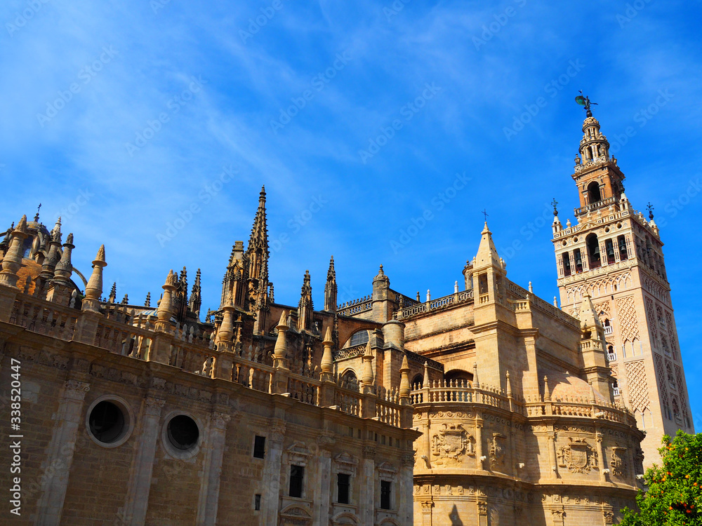 View of the Giralda in Seville, Spain. It is the bell tower of the Cathedral of Saint Mary of the See in Seville, Andalusia, Spain.