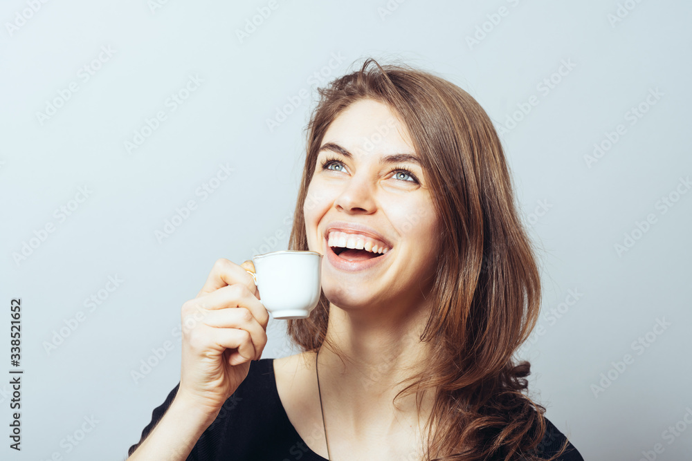 merry cute brunette girl drinking coffee merry cute brunette girl drinking coffee