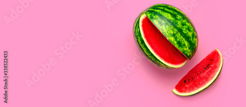 Creative summer food concept. Half and pieces of ripe juicy red watermelon on bright pink background. Flat lay, top view, copy space. Juicy Fresh Summer Berry