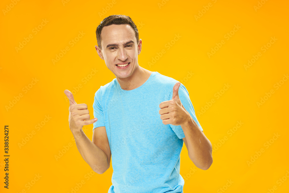 handsome young man showing ok sign handsome young man showing ok sign