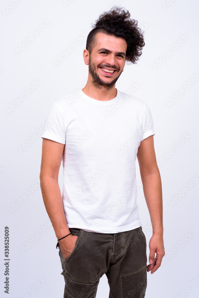Portrait of happy bearded Turkish man smiling Portrait of happy bearded Turkish man smiling