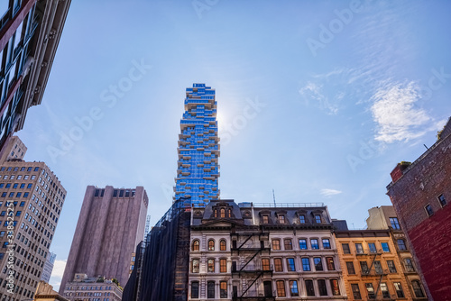 Slika na platnu NEW YORK, USA - OCTOBER 2, 2018: View of the Counseling Tribeca apartments building on Leonard street from The Roxy Cinema square in downtown Manhattan on 6th Ave and Church St