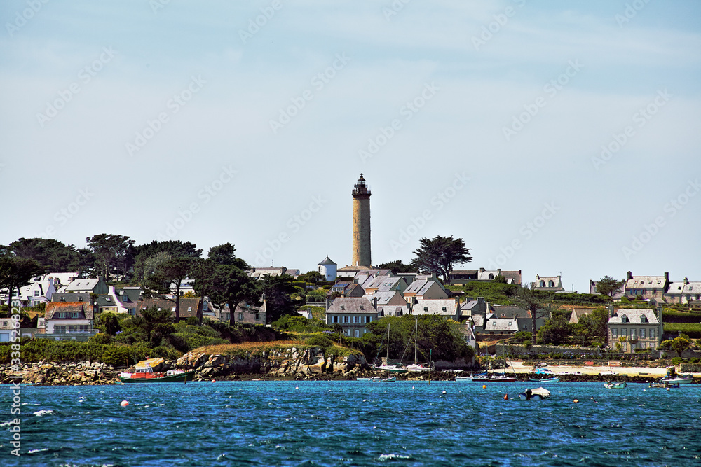 Island of Batz, Франция.  View of the Island of Batz from the sea and the lighthouse a sunny day of summer