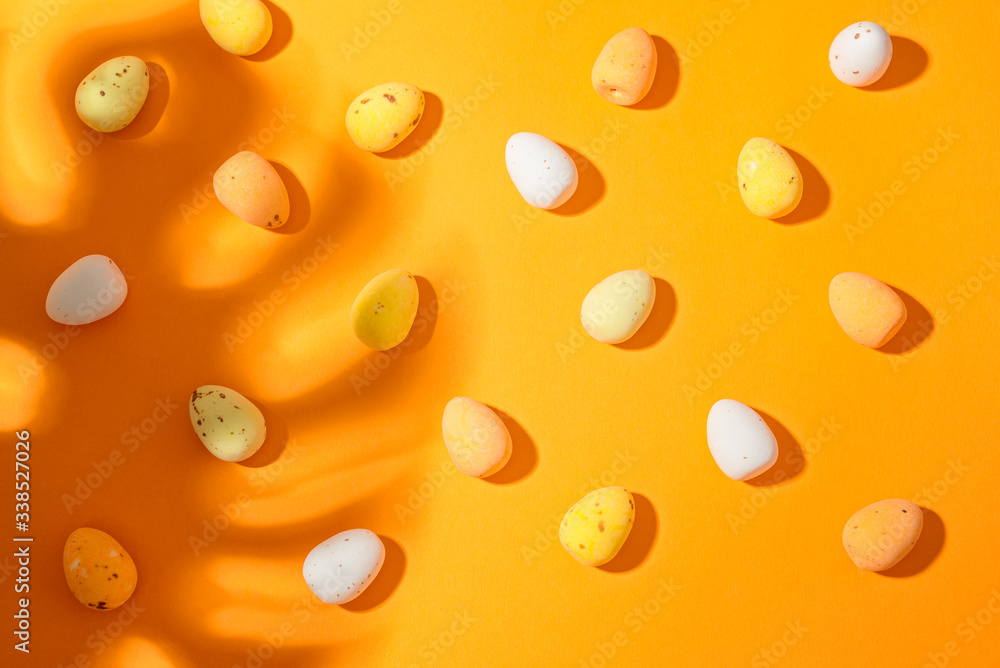 Easter eggs on the orange background closeup copy spase