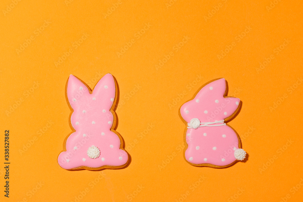 Easter bunny cookies on the orange background