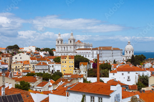 Lisbon, Portugal - July, 24th, 2018 : View from the Miradouro do Recolhimento viewpoint of the Alfama, the oldest district in Lisbon with the 17th-century church and monastery of Sao Vicente de Fora. 