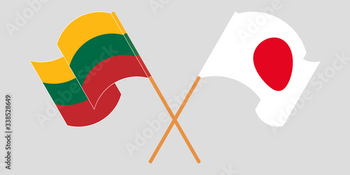 Crossed and waving flags of Lithuania and Japan