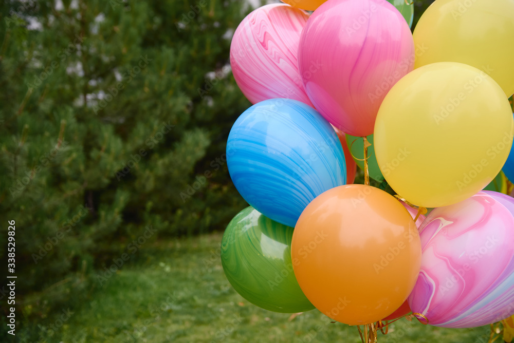 Bunch of yellow, pink, blue, orange and green balloons outdoors, copy space. Holiday party decoration. Colorful balloons. Valentines day Bunch of yellow, pink, blue, orange and green balloons outdoors, copy space. Holiday party decoration. Colorful balloons. Valentines day