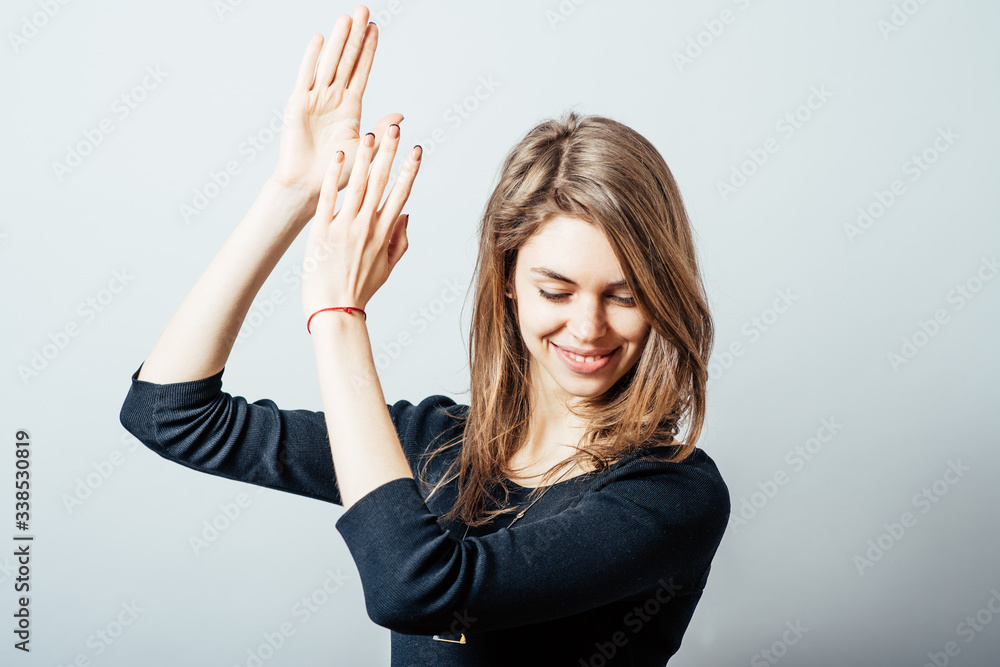 Portrait of happy applauding young woman Portrait of happy applauding young woman