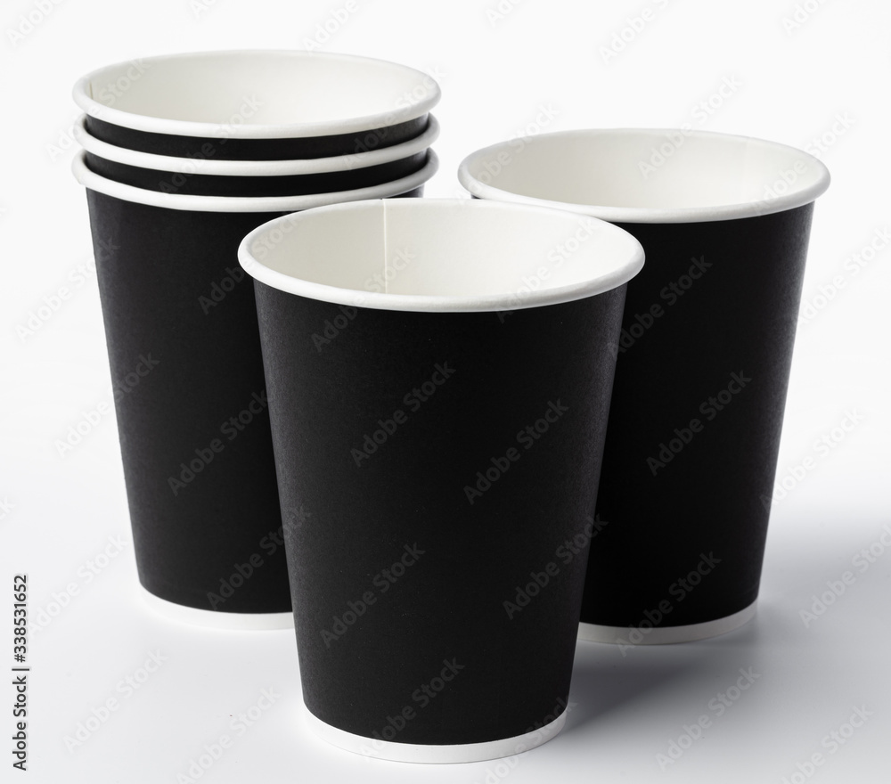 Paper coffee cups isolated on white background. Close up. Paper coffee cups isolated on white background. Close up.