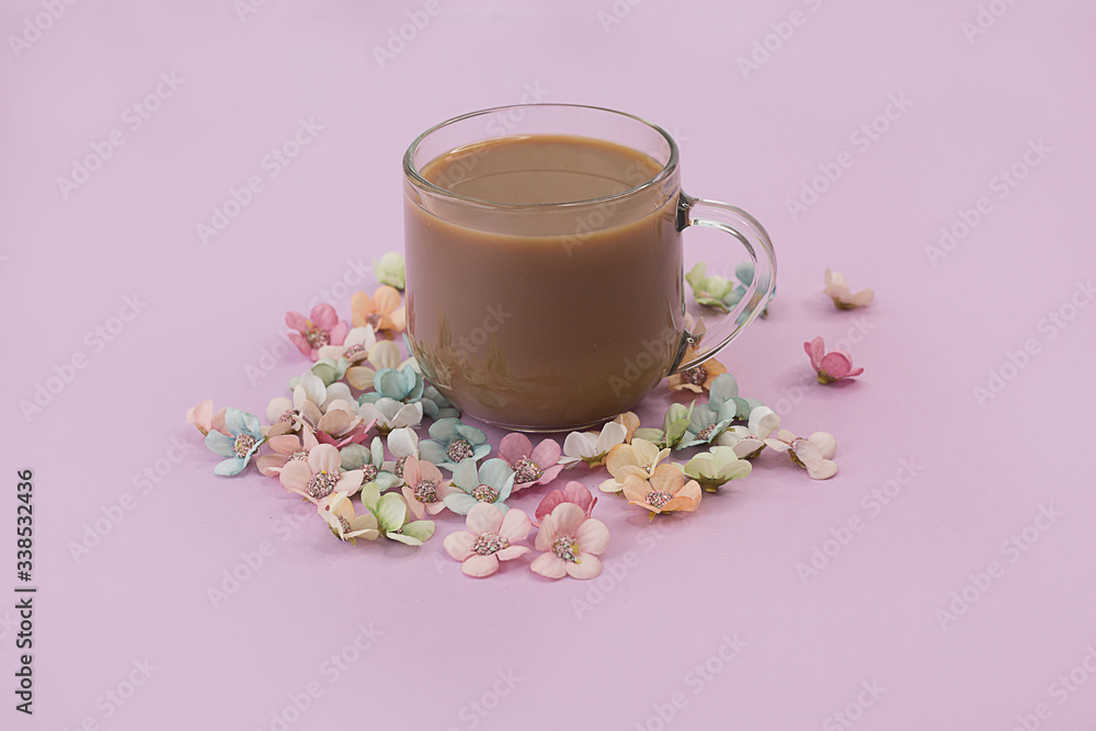Cup of coffee on a pink background with flowers. Cup of coffee on a pink background with flowers.