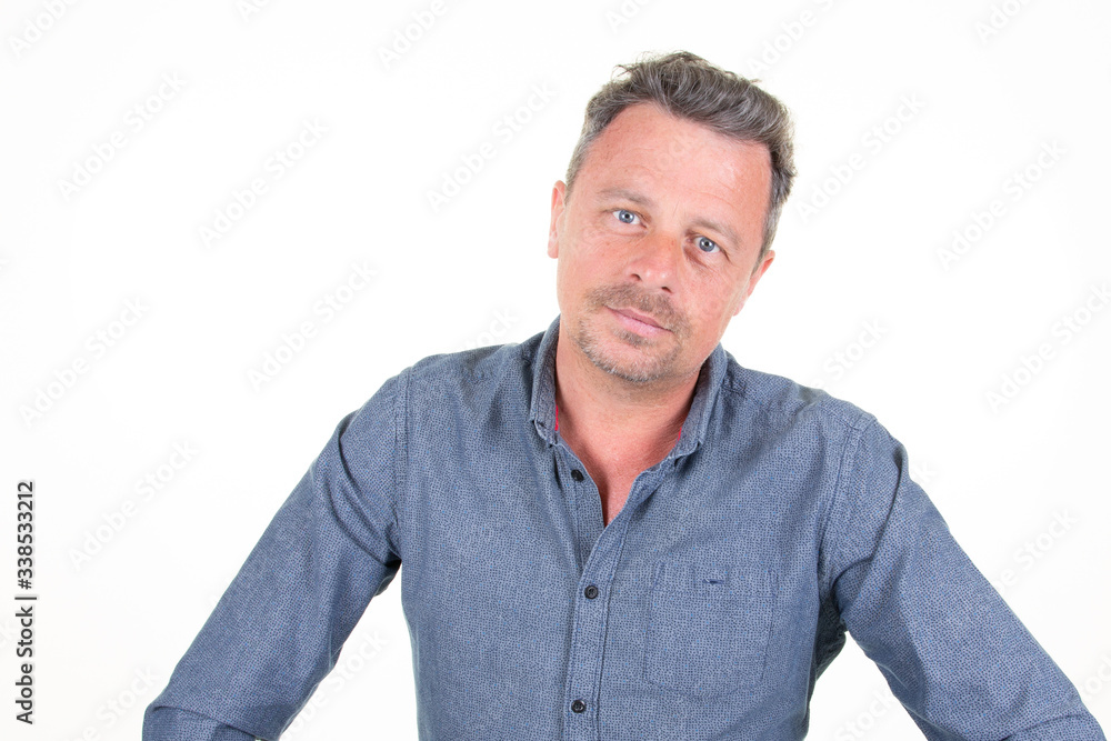 guy handsome bearded man in casual blue shirt poses in studio on white background guy handsome bearded man in casual blue shirt poses in studio on white background