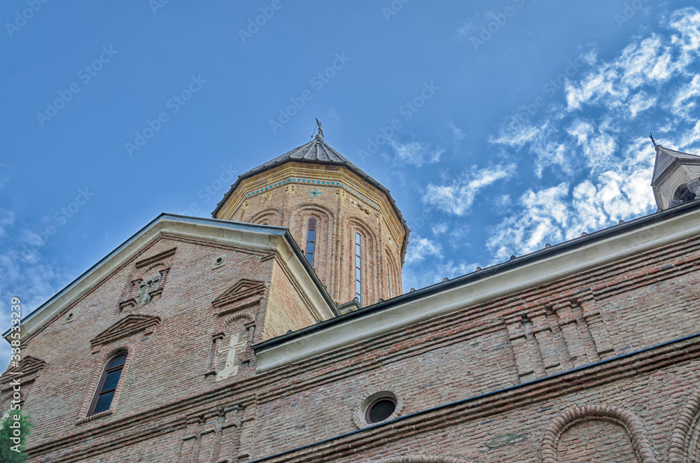 Temple of the Georgian Orthodox Church on a background of blue sky