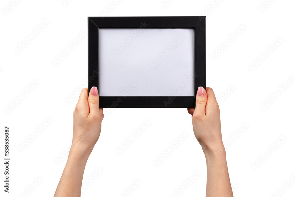 Female hands holding photo frame with copy space isolated on white Female hands holding photo frame with copy space isolated on white