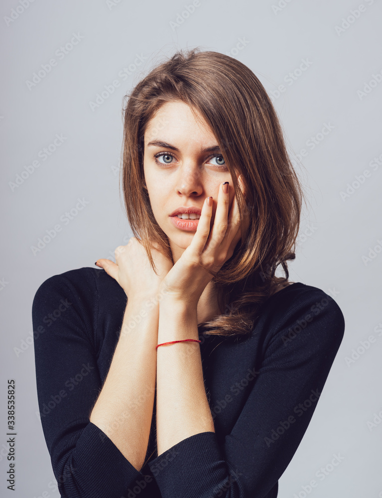 depressed girl on a gray background depressed girl on a gray background